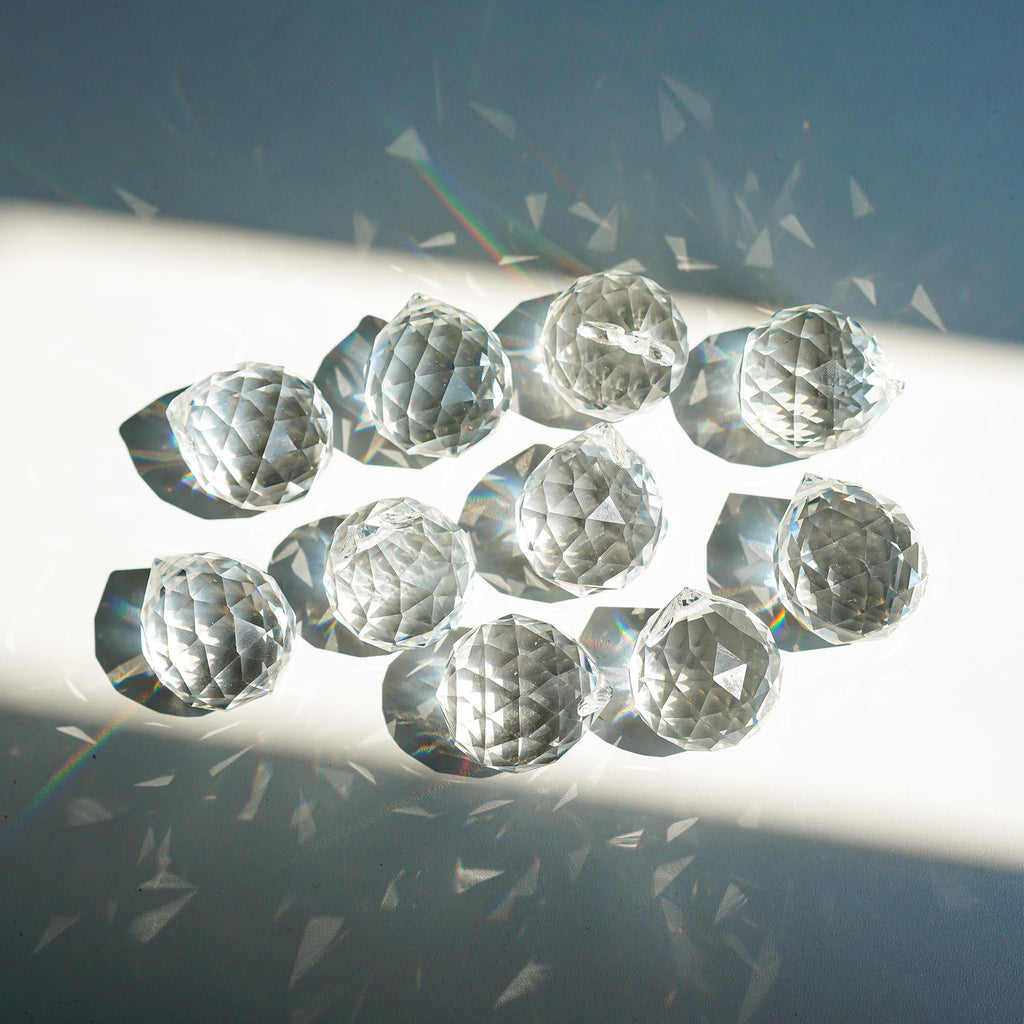 Crystal Prism 12PCS 1.2" Crystal Ball Prism K9 Glass Hanging Ornaments | Precision Faceted Cuts Brilliant Rainbow Reflections Ideal for Suncatchers Weddings DIY Crafts Chandeliers Home Decor